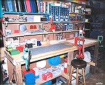 My 8' long loading bench.  Presses bolted down from left to right are a circa 1967 RCBS Jr single-stage, simple leverage machine, a Hornady Pro-Jector progressive, and a Redding Boss single stage with