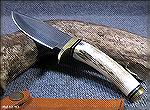 An inexpensive but nice Marble's Dmascus blade knife with antler scales.
