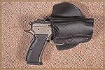 This Safariland Model 568 Paddle holster is adjustable to fit 80-some pistols. Here it holds a 10mm EAA steel full-size Witness with 4.5" barrel