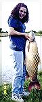 Using 6-pound test line and a white Mr. Twister lure, Lavita Holland of Richmond, Ind. landed this 41 pound, 4 ounce state record grass carp in a private pond in late May 2000.
