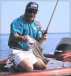 Angler shows a nice reservoir largemouth.