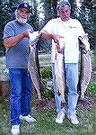 Bruce Fritz & Mike McCormick display three of 10 pike caught in four hours on May 31, 2002 at Colorado''s Vallecito Lake. The two largest -- both fat females -- were just under 15 pounds and the small