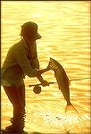 Lefty Kreh shot this photo of a young lady showing off a nice fly-caught bonefish.