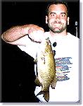 nice smallmouth at sunset on flyrod popper Upper Saranac Lake, NYSmallmouth topwater at nightphoto property of Guides For Hire.com