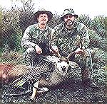 Mike Clerc says, "I'm the fat one on the right, my trusty side-kick is Scott Johnson, on the left. The buck was taken at 30 yards, Mathews bow, 2417 XX75 shafts and Muzzy 125gr 3 bladed broadheads. Th