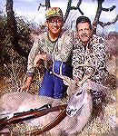 Guide Duwane Adams (L)and hunter Tony Mandile with a Coues deer buck killed in Sonora, Mexico. The buck had a 16.5" spread and scored just over 100 B&C points. MEXICO COUES DEERTony Mandile