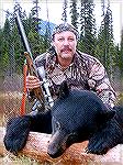 Rick Combs with a nice black bear he killed in Bristish Columbia in May 2003. He used a Barnes X bullet in his muzzleloader. His guide was Brett Thorpe of Bowron River Outfitters. Rich's BC  Bear #1RC