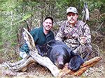 Rich Combs used his bow to take this dandy bruin in British Columbia during the 2003 spring season. His guide was Brett Thorpe (L.) of Bowron River Outfitters.Rich's BC  Bear #2RC