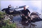 I shot this guy with my 338 and he managed to wade into about 3 feet of water before tipping over. Luckily we towed him fairly close to shore for the real work.