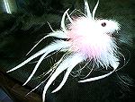 This one of my DISPLAY flys it's tied on a 5/0 hook bent to form, body is kristal ice estas,eyes are red molded, pink,white marabou,long white saddles,silver,gold flash. 
enjoy, GOOD LUCK GOOD TYIN.