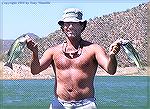 Mike Remlinger, relief pitcher for the Chicago Cubs, caught these two largemouth at Bartlett Lake in Arizona in May, 2004. He was here for rehabilitation for an injury. 

Copyright 2004 by Tony Mand
