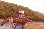 This is a 40 lb wolf fish that I caught in Alaska while Halibut fishing.  We shot it in the head twice before bringing it aboard.  It still grabed the baseball bat gaff and we liked to never get it ou