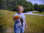 We we suppose to be eating shore lunch. While I was building a fire to cook fish on, She was fishing! Again, another Bass on a Senko worm.