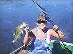 This is my wife and a fish she caught out of a pond on our Texas Hunting lease.