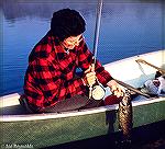 Flyrodder with nice smallmouth caught on the Penobscot River in Maine.