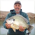 Hector Brito of Arizona holds up a possible world record redear sunfish.